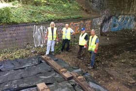 Volunteers laying track last year.