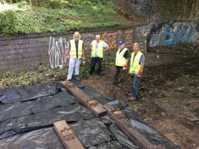Volunteers laying track last year.