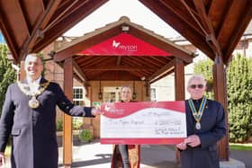 Warwick Mayor Cllr Terry Morris (left) and Warwick Rotary President David Brain (right) with Charlotte Ingram from Myton Hospices. Photo supplied