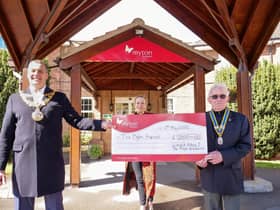 Warwick Mayor Cllr Terry Morris (left) and Warwick Rotary President David Brain (right) with Charlotte Ingram from Myton Hospices. Photo supplied