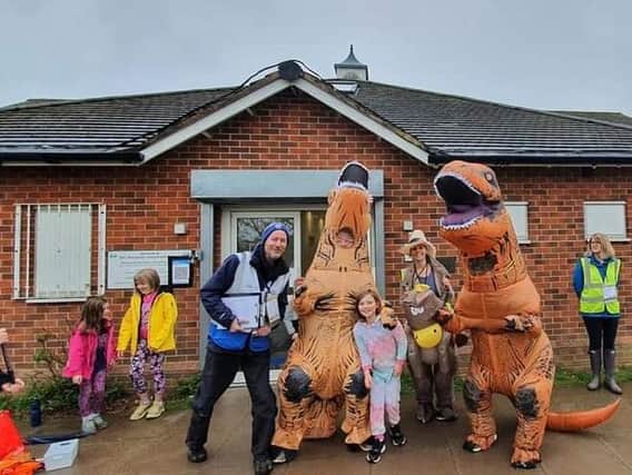 Jurassic guests pose alongside volunteers and Rugby's young runners.