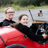 A youngster gets behind the wheel of a stunning Austin 7 Ulster replica.