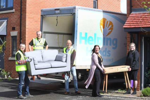 From the left, Jim Palmer, James Sinnott, Andy Brown and Tracey Littlejohns from the Helping Hands Community Project with Stephanie Green from AC Lloyd Homes. Photo supplied