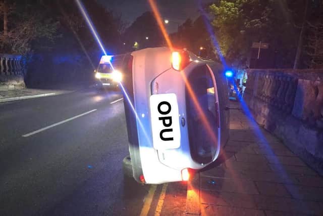 A suspect drug dealer flipped a stolen car and landed the vehicle on it his side during a police chase in Warwick. Photo by OPU Warwickshire.