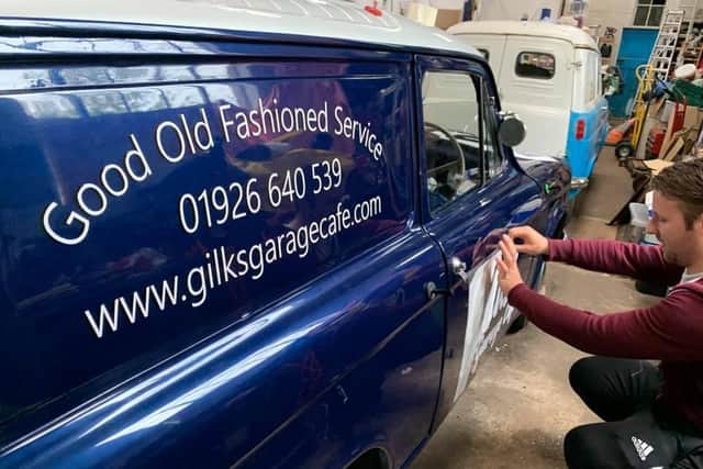 Cameron Mair, the owner of C.M. Signs, prepares the 1961 Commer Cob ready for action as a delivery van for Gilks' Garage Cafe in Kineton