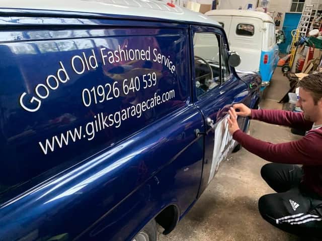 Cameron Mair, the owner of C.M. Signs, prepares the 1961 Commer Cob ready for action as a delivery van for Gilks' Garage Cafe in Kineton