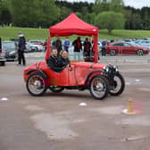 Reporter Alex drives the Austin 7, complete with very patient instructor. Photo courtesy of Max Willson of www.maxfilms.co.uk
