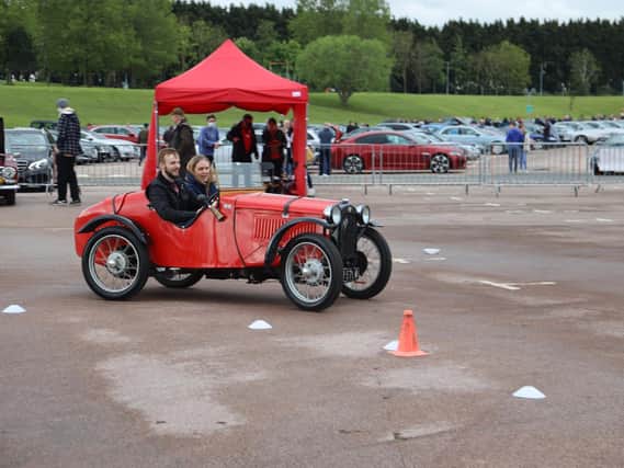 Reporter Alex drives the Austin 7, complete with very patient instructor. Photo courtesy of Max Willson of www.maxfilms.co.uk