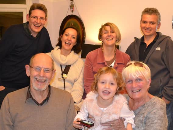 Tony and Joyce Guy with their family.