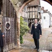 Warwick’s Mayor, Cllr Terry Morris was welcomed by one of the Brethren, Brother Bill, as the ancient wooden gates were once again reopened. Photo by Gill Fletcher
