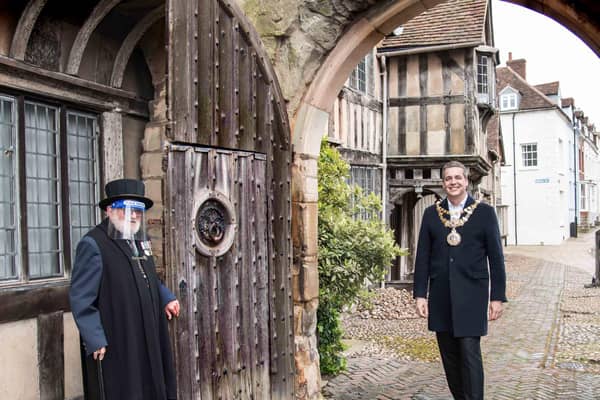 Warwick’s Mayor, Cllr Terry Morris was welcomed by one of the Brethren, Brother Bill, as the ancient wooden gates were once again reopened. Photo by Gill Fletcher