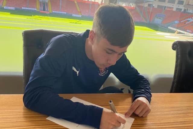 Johnny Johnston signs a one-year professional contract with Blackpool