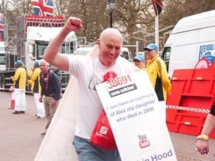 Robin Hood running the London Marathon in support of the charity DEBRA.
