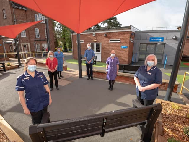 Staff outside the new unit.