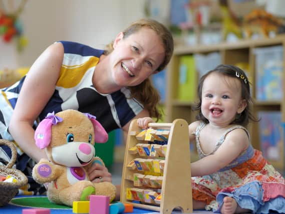 Katie Gedye, assistant head Pre-Prep at Bilton Grange, who will be heading up the Little Grange project, getting to know eight-month-old Olivia.