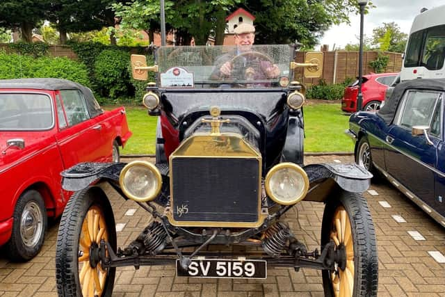 John behind the wheel of the 1915 Model T.