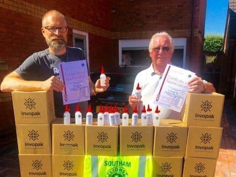 Southam Lions Peter Guy and Ben Wilde with hand sanitiser. Photo supplied