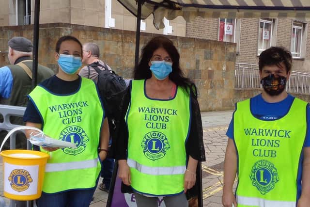 Warwick Lions handing out face masks at Warwick market. Photo supplied