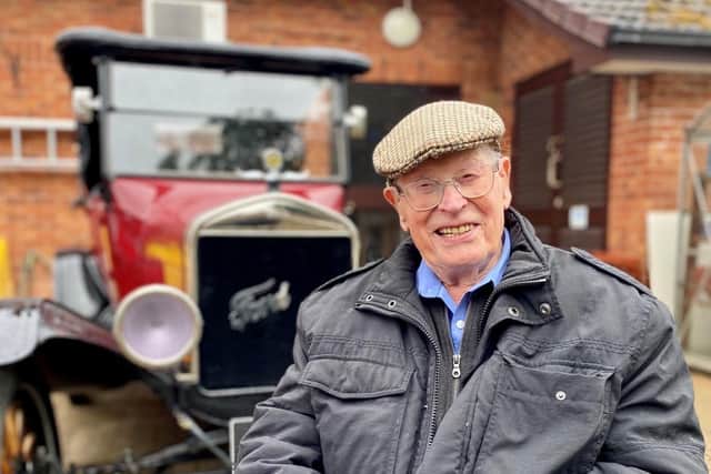 John Farringdon with a classic Ford car.