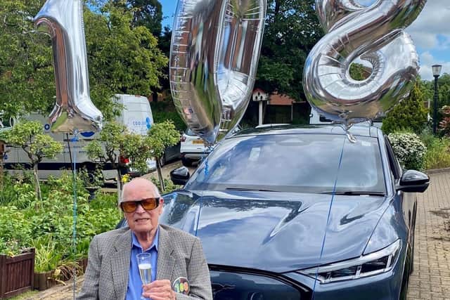 John Farringdon with the Ford Mustang Mac-E, which was brought to Cubbington Mill Care Home as part of his 108th birthday celebrations.