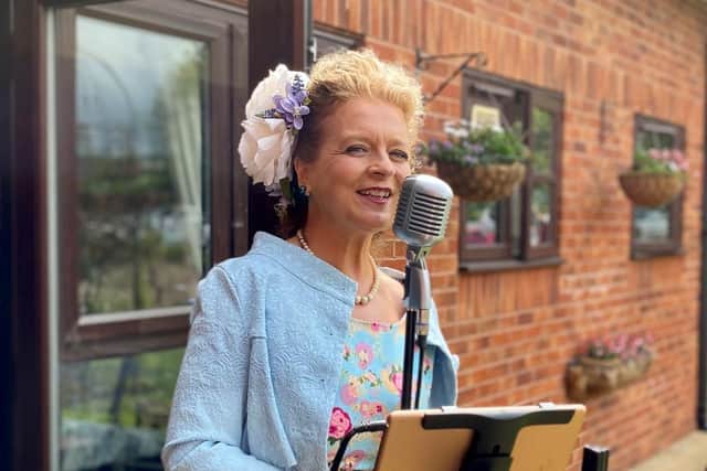 Vintage singer Celine Rose sang songs from the 19040s for John Farringdon's 108th birthday celebrations.