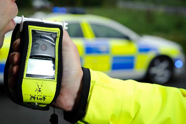 A driver allegedly spat at and tried to bite a police officer as he attempted to arrested him on suspicion of drink driving in Leamington.