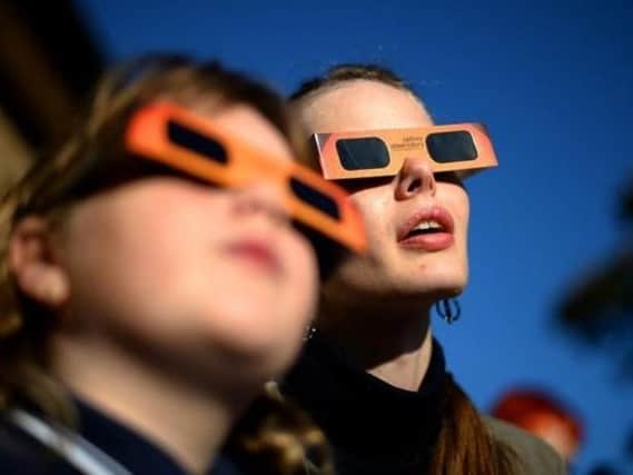 Experts warn not to look directly at the partial eclipse without special glasses