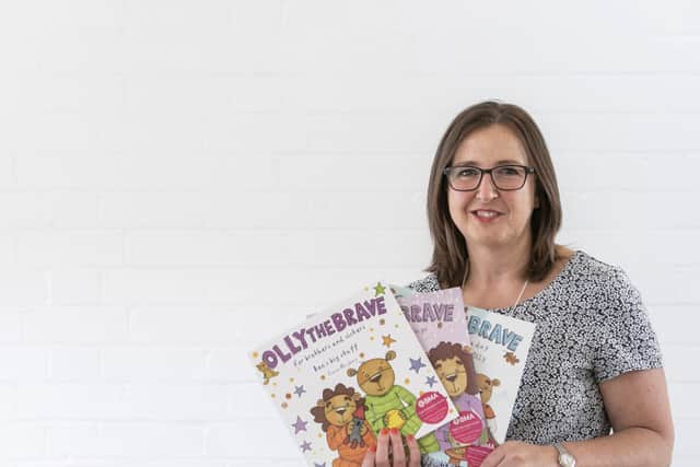 Rachel Ollerenshaw with some of the Olly The Brave books. Photo by Karen Massey Photography