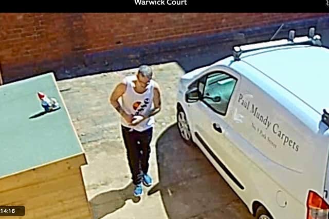 Still image taken from the CCTV footage just before Ralph the Gnome was 'abducted' by this man.