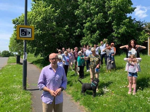 Warwick and Leamington MP Matt Western with some of the residents on the Woodloes who are against the plans for the new 5G mast. Photo supplied.