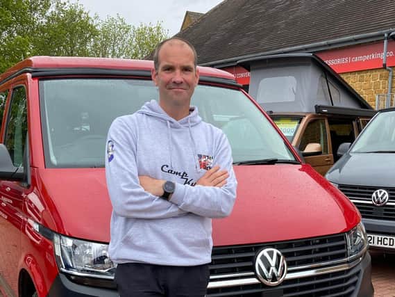 Si Hannaford with the campervan he will be using to rest during his demanding triathlon