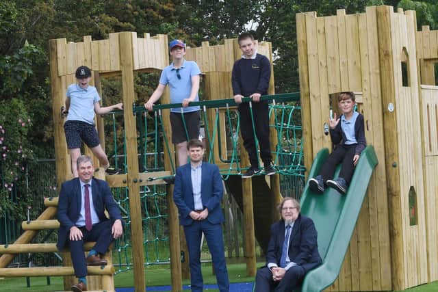 From right to left - Mark Freeman, Nick Evans and Grant Howard, with pupils from Evergreen School at The Bethell Adventure Playground. Photo supplied