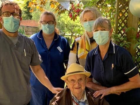 Pictured with Walter are Allan Fairweather (home manager) Pauline and Sarah (care staff) and Jacinda who is a close friend to Walter.