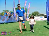 Craig McKee crosses the finish with three-year-old daughter Sophie  (PICTURE: MY SPORT PHOTOS - WWW.MYSPORTPHOTOS.CO.UK)