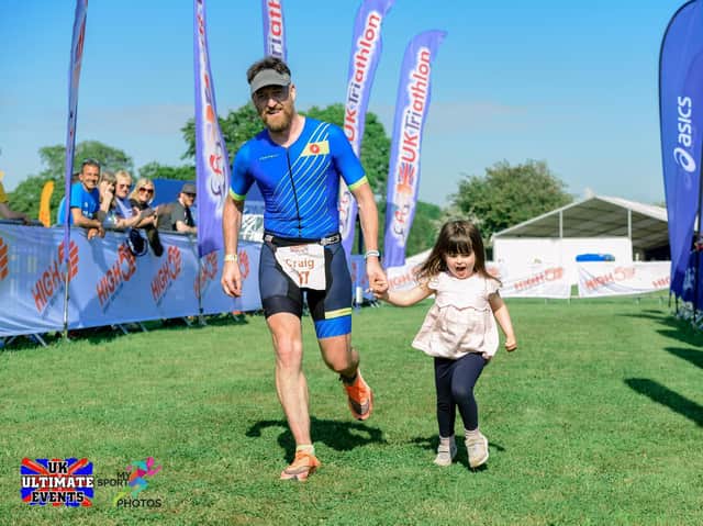 Craig McKee crosses the finish with three-year-old daughter Sophie (PICTURE: MY SPORT PHOTOS - WWW.MYSPORTPHOTOS.CO.UK)