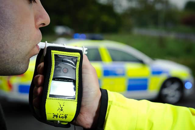 A driver from Whitnash has been charged with drink driving after a car collided with a row of parked vehicles.