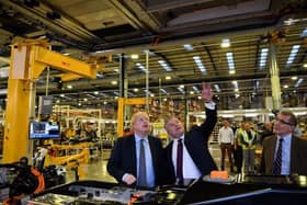 MP Mark Pawsey (right) with the Prime Minister Boris Johnson MP (left) and Joerg Hofmann, CEO of the London Electric Vehicle Company (centre) at the LEVC’s factory at Ansty Park in Rugby.