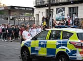 Fans gather in the street to celebrate England's 2-0 win over Germany.