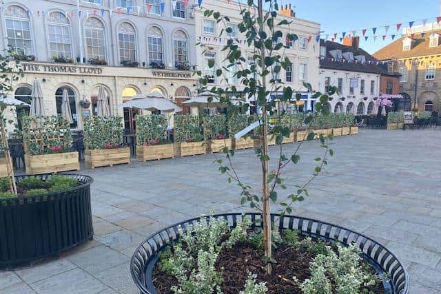 Some of the grant money has been used to buy new street furniture such as planters which also act as screens. These have replaced old barriers