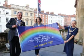 Warwick District Council chairman Cllr Neale Murphy, Anne Coyle (managing director of South Warwickshire NHS Foundation Trust) and the Mayor of Leamington, Cllr Susan Rasmussen with the thank you flag.