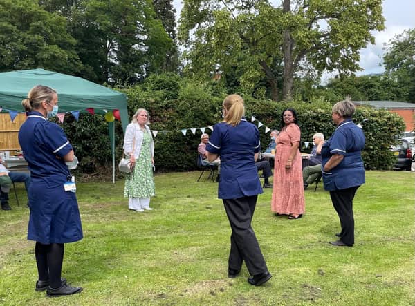 Staff speak with Rugby's Mayor (second from right).