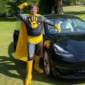 Kwalee CEO David Darling dressed as a 'Hypercasual Hero' to launch the games company's challenge in which indie developers can win substantial investment and a Tesla Model 3 electric car (pictured).