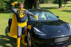 Kwalee CEO David Darling dressed as a 'Hypercasual Hero' to launch the games company's challenge in which indie developers can win substantial investment and a Tesla Model 3 electric car (pictured).