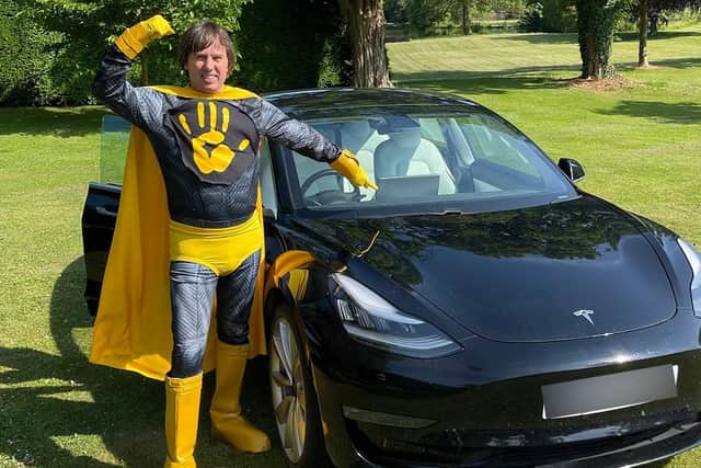 Kwalee CEO David Darling dressed as a 'Hypercasual Hero' to launch the games company's challenge in which indie developers can win substantial investment and a Tesla Model 3 electric car (pictured).