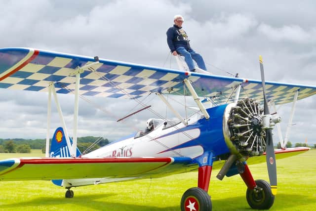 President Peter Amis about to take off on his wing walk. Photo supplied