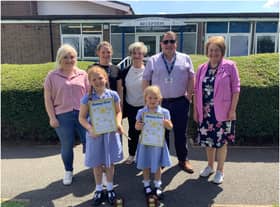 Sophia and Florence Halford. They are photographed with their mum, class teacher Miss Fletcher, their grandmother, dad and Rotarian Margaret Morley. Photo supplied