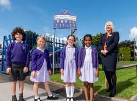 Pupils of Our Lady and St Teresa’s Catholic Primary School with Bellway sales advisor Tina Yates.