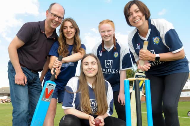 Kevin Mitchell, chairman of Leamington Cricket Club, Marie Bawden, head of women and girls’ cricket with young players from the club's women and girls’ section.