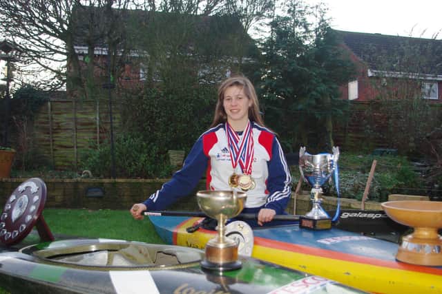 Kimberley Woods with her collection of medals and trophies in 2012