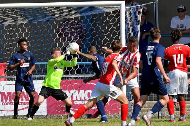 New keeper Ben Newey saves close range header against Stourbridge